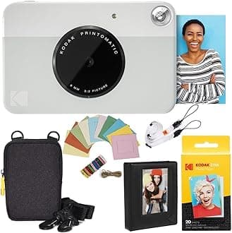 Printomatic Instant Camera (Grey) Deluxe Bundle + Zink Paper (20 Sheets) + Deluxe Case + Photo Album + Hanging Frames + Comfortable Neck Strap